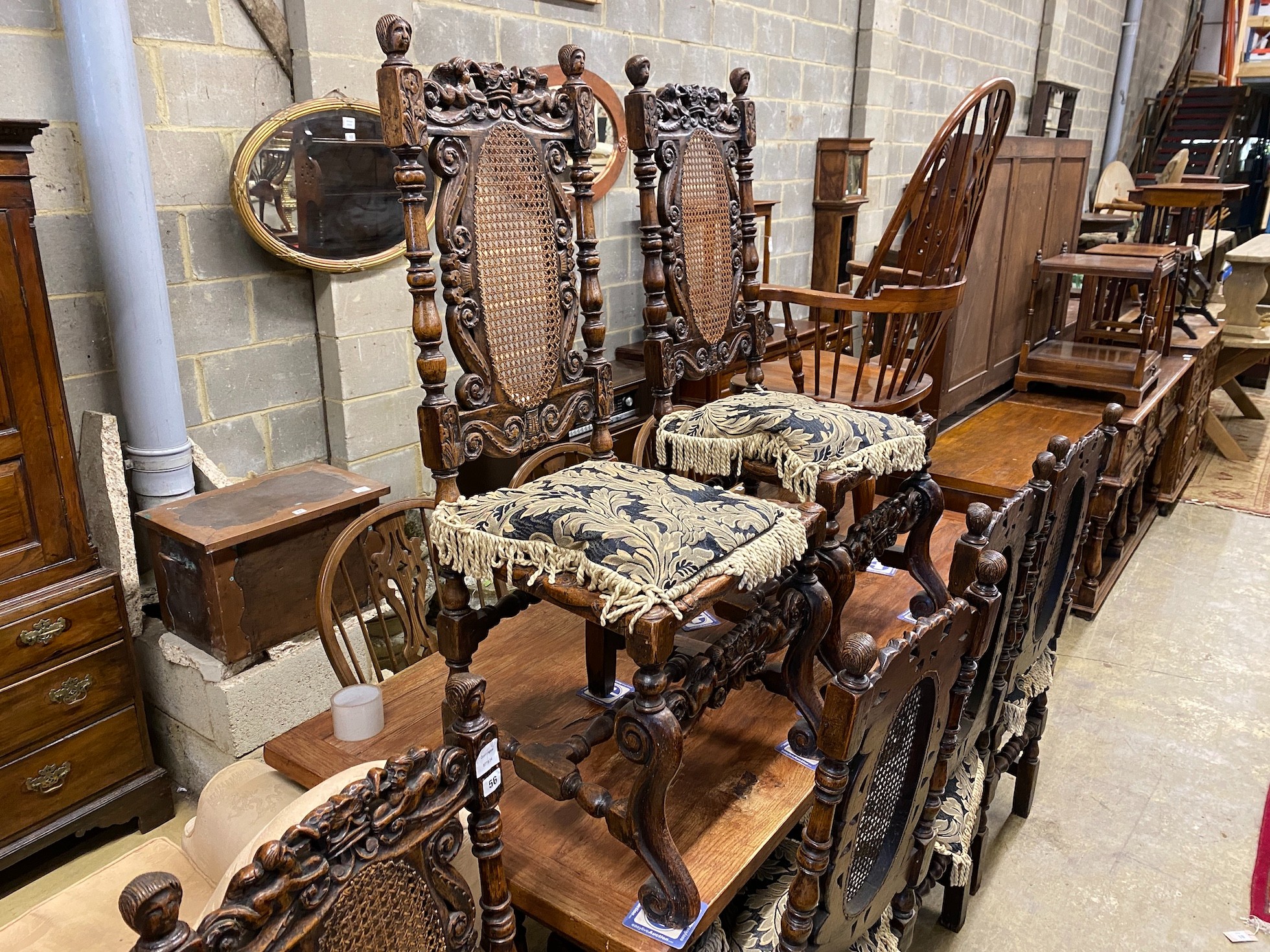 A set of six Carolean style caned oak dining chairs, width 54cm, depth 46cm, height 121cm